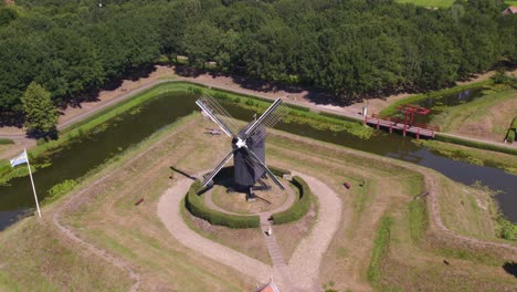 Orbit-shot-of-windmill-at-fortress-Bourtange-Groningen,-aerial