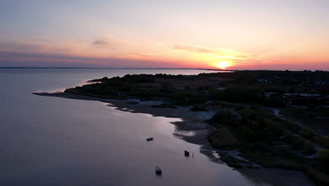 Drone-shot-of-Beautiful-coastline-during-golden-hour-in-Poland,Europe---backwards-shot