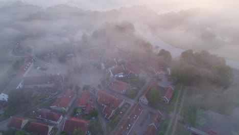 Drone-view-of-touristic-fortress-Bourtange-groningen-with-low-fog-in-the-morning,-aerial