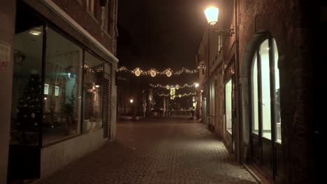 Night-time-walk-at-Mariastraat-Maastricht-with-Christmas-lighting-decoration