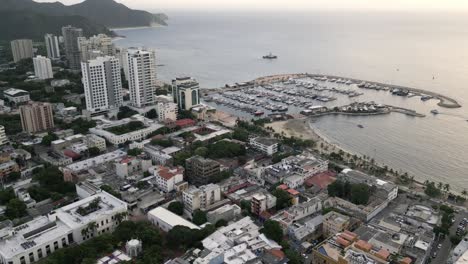 Aerial-Panoramic-Above-Yacht-Marine-Port-in-Santa-Marta-Colombia-Seaside-Town-in-Caribbean-Sea,-Travel-Destination