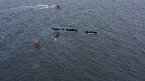 Currach-boats-and-racers-hurry-to-row-around-buoy-in-epic-race-on-open-ocean