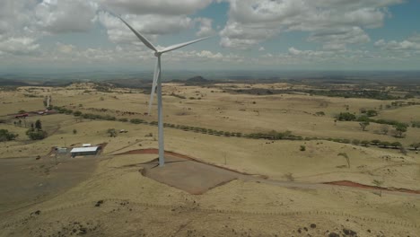 Panning-drone-shot-of-a-critically-important-wind-farm-located-in-Tilaran,-Guanacaste,-Costa-Rica