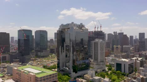 Amazing-wide-aerial-of-Osaka-landmark-Umeda-Sky-Building-with-skyline,-skyscrapers,-and-city-in-Osaka,-Japan