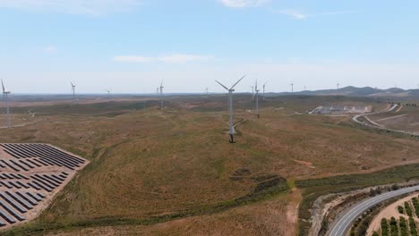Panoramic-aerial-overview-of-renewable-energy-wind-and-solar-farms-in-desert