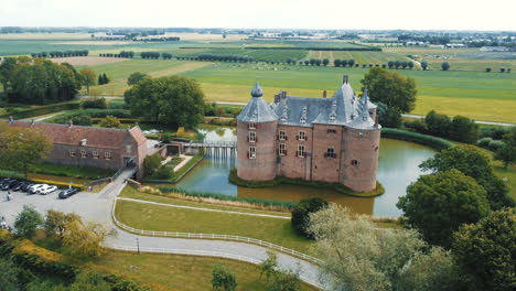 Ammersoyen-castle:-aerial-view-traveling-in-from-the-side-of-the-beautiful-castle-and-making-out-the-bridge-and-the-moat-that-surrounds-it