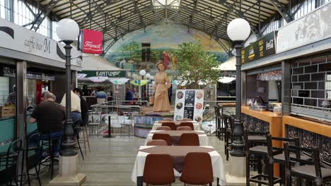 Customers-sitting-down-at-a-cafe-in-Pula-Market-Northwestern-Croatia