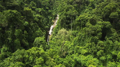 Approaching-aerial-reveal-of-Huay-To-waterfall-in-Krabi,-Thailand