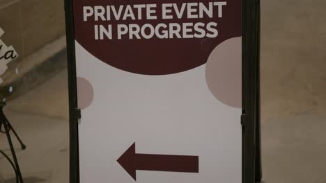 Wedding-Day-stock-clip-of-private-event-in-progress-sign-welcoming-guests-to-venue-on-black-A-Frame-with-arrow-pointing-left-with-room-for-copy