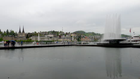 Wide-view-of-a-large-mountain-in-the-waters-of-Wagenbachbrunnen,-Lucerne,-Switzerland