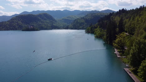 Aerial-view-of-a-lone-kayak-in-Lake-Bled,-Slovenia