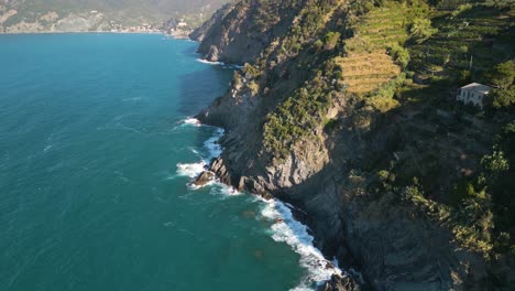 Aerial-Pan-Up-Reveals-Cinque-Terre-Terrace-Farming-in-Mountains