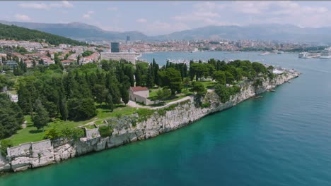 A-gentle-arcing-shot-around-Sustipan-Park-on-the-edges-of-Split,-Croatia-on-a-bright-afternoon