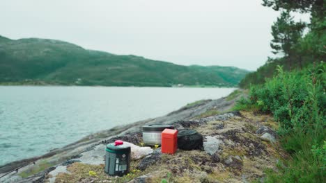 Outdoor-Cooking-And-Food-At-Campsite-By-The-Shore-Of-Pevika-Inlet-In-Trondelag,-Norway