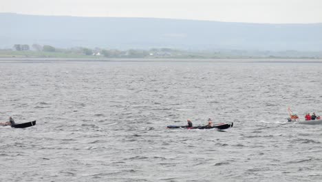 Currach-rowers-pull-oars-with-great-strength-across-galway-bay