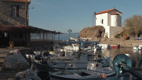 Panagia-Gorgona-Church-beyond-fishing-boats-in-Skala-Sikamineas-Harbour