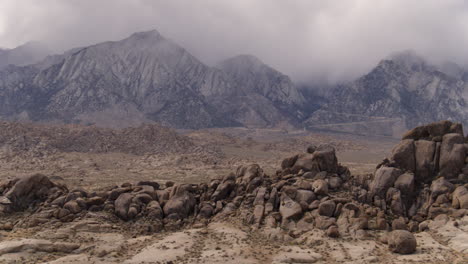 Aerial-Drone-dolly-around-the-Alabama-Hills-of-California's-Sierra-Nevada-Mountain-Range-while-clouds-gather