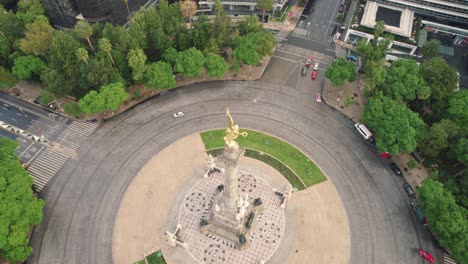 Angel-of-Independence,-Aerial-view,-of-the,-iconic-monument,-shining-gold,-Paseo-de-la-Reforma-avenue,-Mexico-City,-Mexico,-spinning-drone-shot,-drone,-spinning