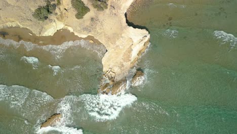 Aerial-View-of-Waves-On-The-Rocky-Shore-Of-Beach-in-Kos,-Greece