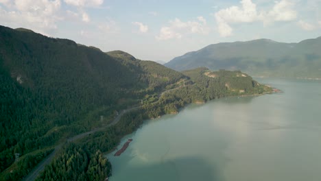 Aerial-pan-of-Howe-Sound-coastline,-Squamish,-BC,-Canada