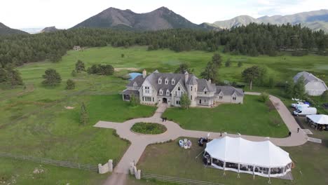Aerial-scenic-view-of-wedding-at-Greystone-Castle-luxury-venue,-Boulder,-Colorado,-United-States