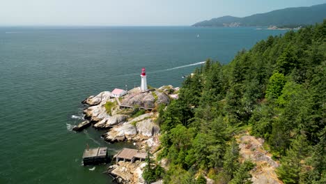 Aerial-view-of-Lighthouse-Park-lighthouse-and-coasltine,-West-Vancouver,-BC,-Canada