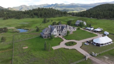 Aerial-view-of-wedding-is-happening-at-magical-Greystone-Castle,-Colorado