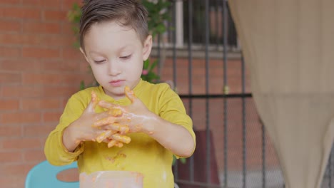 A-little-boy-played-with-dough-in-his-hands