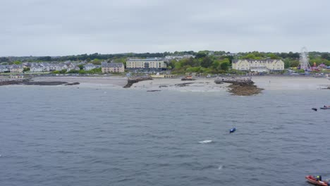 Drone-aerial-view-of-salthill-galway-ireland-coast-and-homes,-near-ladies-beach