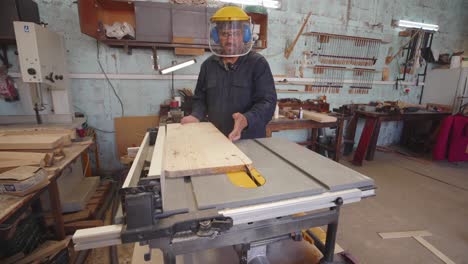 Typical-scene-from-carpenter-work-environment,-operating-table-saw,-indoor