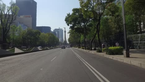 POV-shot-driving-along-Paseo-de-la-Reforma-towards-Angel-de-la-Independencia