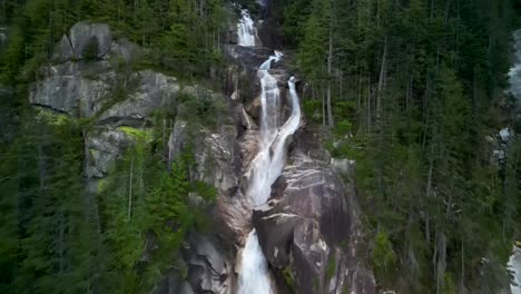 Aerial-view-up-Shannon-Falls-waterfalls-at-dusk,-Squamish,-BC,-Canada