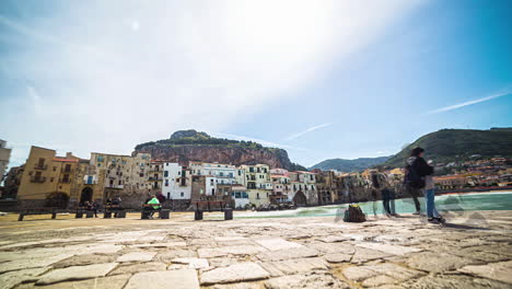 time-lapse-of-people-gathering-in-an-old-town-square-on-the-Sicilian-coast