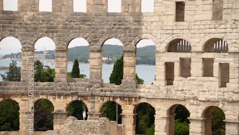 Inside-the-Amphitheater-at-Pula,-Croatia-and-the-Adriatic-Sea-beyond