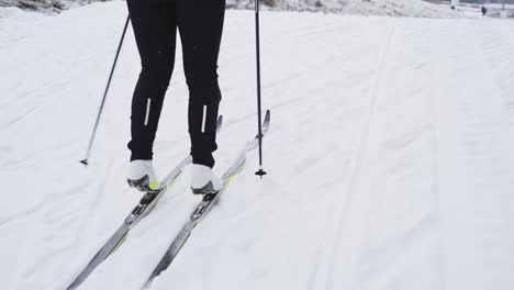 Tracking-medium-shot-of-lower-body-of-a-cross-country-skiier