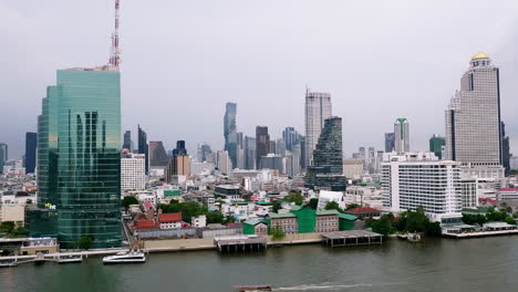 Zoomin-of-Business-city,-view-with-an-aerial-view-of-Bangkok-downtown