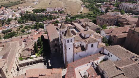 White-iglesia-de-san-francisco-javier,-medieval-church-in-Caceres-Spain,-aerial
