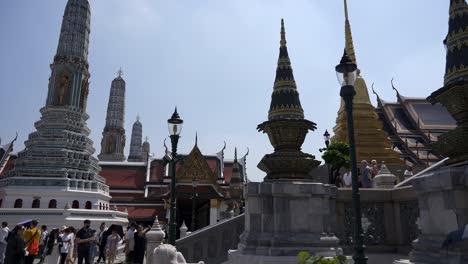 Slow-motion-revealing-shot-of-tourists-taking-photos-at-the-Emerald-Buddha-Temple