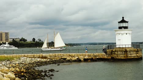 Tourists-at-Buglight-Park-with-sailboat-in-Casco-Bay-Harbor