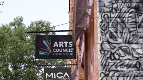 Arts-Council-of-Greater-Lansing-in-Lansing,-Michigan-Old-Town-district-with-video-tilting-down
