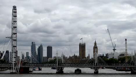 Trains-and-boats-going-under-the-London-Eye-and-Big-Ben,-London,-United-Kingdom
