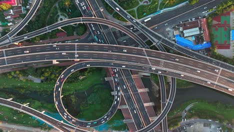 Aerial-photography-of-urban-transportation-roads-Aerial-vehicle-driving-on-urban-overpass-Busy-urban-transportation-Aerial-photography-of-crisscrossing-urban-overpasses