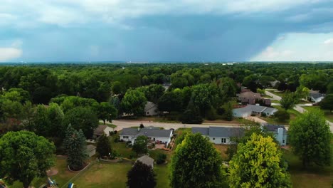 fast-aerial-flying-over-suburban-Appleton,-Wisconsin-toward-a-massive-rain-storm