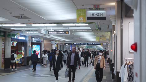 People-Passing-Through-The-Underground-Hallway-In-Sapporo,-Japan