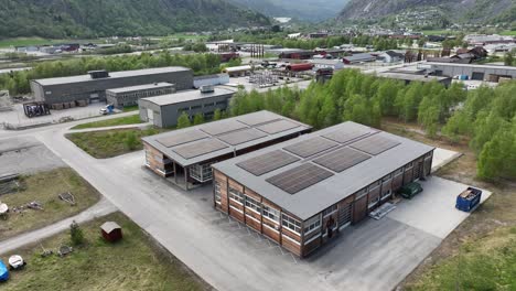 Modern-office-and-warehouse-building-with-slar-panels-in-industrial-area-at-Gaupne-Norway---Sustainable-energy-production-in-business