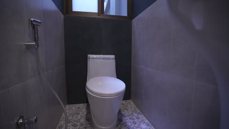 Gimbal-shot-of-the-toilet-and-bathroom,-Sanitary-ware
