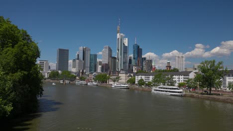 Frankfurt-Skyline-With-Ferry-Boats-At-Main-River-In-Frankfurt,-Germany