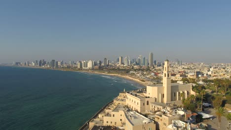 Aerial-view-of-Tel-Aviv-coastline-on-a-beautiful-day-over-The-Mediterranean-Sea