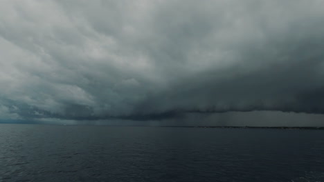 Stormy-cinematic-scene-of-dark-clouds-viewed-from-boat-in-the-Philippines,-Asia