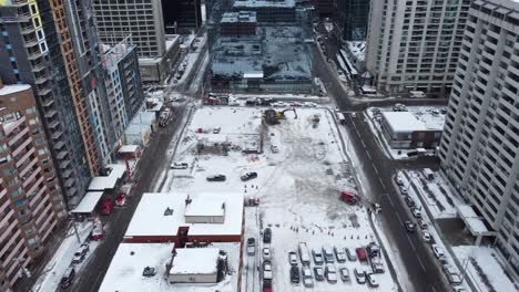 Aerial-overview-of-snowy-downtown-ottawa-ontario-canada-empty-building-plot,-Freedom-convoy-truckers-protest